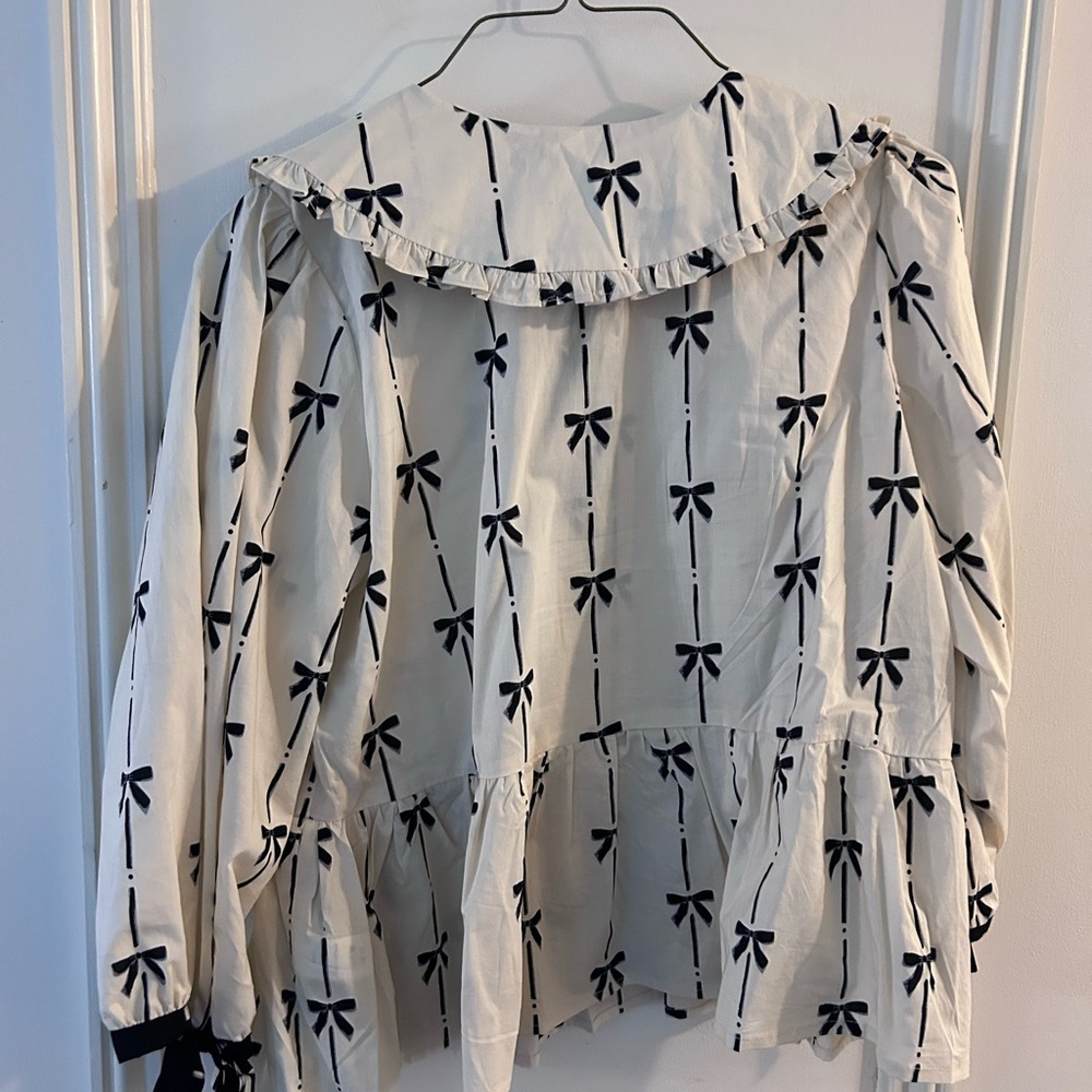 Ruffled Bow-Print Peplum Blouse in Ivory and Black - Picture 6 of 6